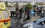 Israeli border police and mounted security forces arrive on May 16, 2021 at the scene where a car-ramming attack wounded several people in East Jerusalem. (Menahem KAHANA / AFP)