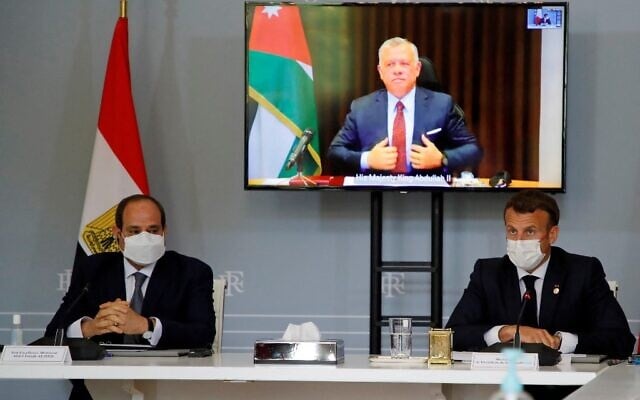 French President Emanuel Macron (R) and Egyptian President Abdel-Fattah el-Sissi attend a video conference with Jordan's King Abdullah II (on screen) to work on a concrete proposal for a ceasefire and a possible path to discussions between Israel and the Palestinians at the Elysee Palace in Paris, on May 18, 2021. (SARAH MEYSSONNIER / POOL / AFP) French President Emanuel Macron (R) and Egyptian President Abdel-Fattah el-Sissi attend a video conference with Jordan's King Abdullah II (on screen) to work on a concrete proposal for a ceasefire and a possible path to discussions between Israel and the Palestinians at the Elysee Palace in Paris, on May 18, 2021. (SARAH MEYSSONNIER / POOL / AFP)