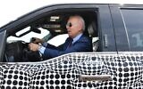US President Joe Biden drives the new electric Ford F-150 Lightning at the Ford Dearborn Development Center in Dearborn, Michigan on May 18, 2021. (Nicholas Kamm / AFP)