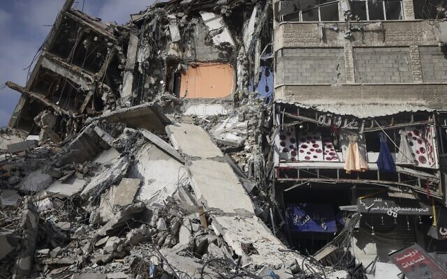 A picture shows destroyed buildings in Gaza City's Rimal area on May 20, 2021 after it was bombed by an Israeli air strike following rocket fire (MAHMUD HAMS / AFP) A picture shows destroyed buildings in Gaza City's Rimal area on May 20, 2021 after it was bombed by an Israeli air strike following rocket fire (MAHMUD HAMS / AFP)