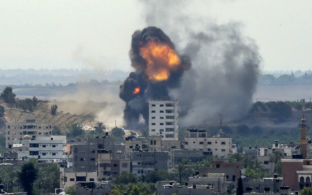 A ball of fire erupts from a building in Gaza City's Rimal residential district on May 20, 2021, during an Israeli bombardment on the Hamas-controlled enclave following rocket fire (BASHAR TALEB / AFP)