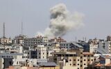 A ball of fire erupts from a building in Gaza City's Rimal residential district on May 20, 2021, during Israeli strikes on the Hamas-controlled enclave in response to rocket fire (MAHMUD HAMS / AFP)