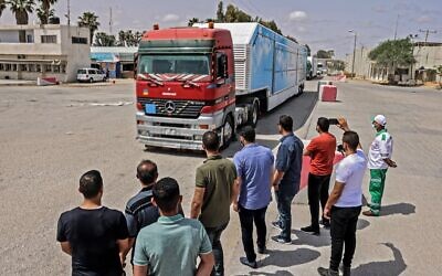 A Jordanian mobile field hospital passes into Rafah in the southern Gaza Strip, through the Kerem Shalom crossing, the main passage point for goods entering Gaza from Israel, on May 21, 2021, after a ceasefire brokered by Egypt between Israel and the Palestinian Hamas  terror group. (SAID KHATIB / AFP)
