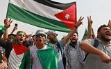 Supporters of Jordan's Muslim Brotherhood take part in a protest in the village of Sweimeh, near the Jordanian border with the West Bank, on May 21, 2021. (Khalil MAZRAAWI / AFP)