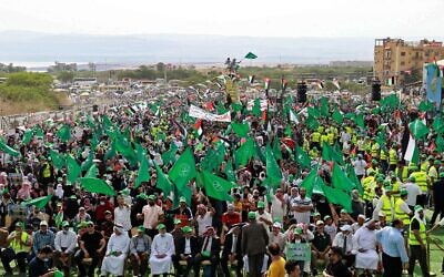 Supporters of Jordan's Muslim Brotherhood take part in a protest in the village of Sweimeh, near the Jordanian border with the West Bank, on May 21, 2021 (Khalil MAZRAAWI / AFP)