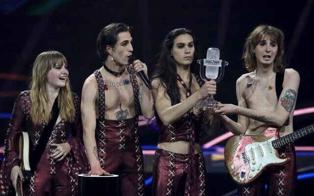 Italy's Maneskin celebrate on stage with the trophy after winning the final of the 65th edition of the Eurovision Song Contest 2021, at the Ahoy convention center in Rotterdam, on May 22, 2021. (Kenzo Tribouillard / AFP) Italy's Maneskin celebrate on stage with the trophy after winning the final of the 65th edition of the Eurovision Song Contest 2021, at the Ahoy convention center in Rotterdam, on May 22, 2021. (Kenzo Tribouillard / AFP)