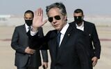 US Secretary of State Antony Blinken waves upon arrival at Queen Alia International Airport, in the Jordanian capital Amman, on May 26, 2021. (Alex Brandon/POOL/AFP)