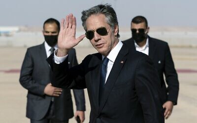 US Secretary of State Antony Blinken waves upon arrival at Queen Alia International Airport, in the Jordanian capital Amman, on May 26, 2021. (Alex Brandon/POOL/AFP)