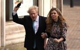 In this file photo taken on May 6, 2021, Britain's Prime Minister Boris Johnson and partner Carrie Symonds arrive at Methodist Hall in central London to cast their votes in local elections. (AFP)
