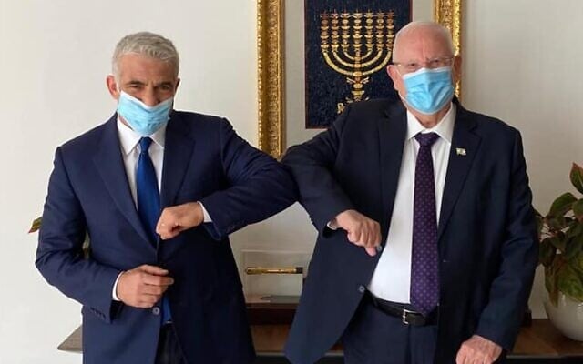 Yesh Atid chairman Yair Lapid with President Reuven rivlin on July 8, 2020. (Yair Lapid/Facebook) Yesh Atid chairman Yair Lapid with President Reuven rivlin on July 8, 2020. (Yair Lapid/Facebook)