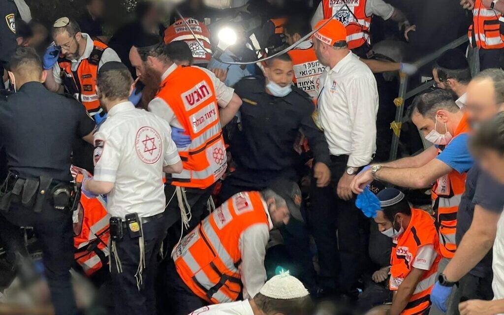 Rescuers at Mount Meron, shortly after tragedy unfolded. Avi Marcus, director the the medical department at United Hatzalah of Israel, is top left. (courtesy of United Hatzalah) Rescuers at Mount Meron, shortly after tragedy unfolded. Avi Marcus, director the the medical department at United Hatzalah of Israel, is top left. (courtesy of United Hatzalah)