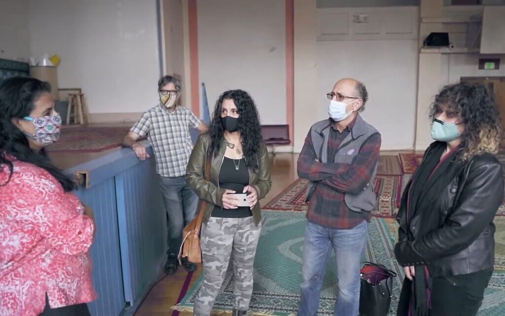 Members of the team seeking to renovate the former Seattle Talmud Torah building, now the Cherry Street Mosque. (Youtube/Screenshot)
