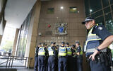 FILE -- A group of police officers at Melbourne Magistrate's Court, Australia, March 5, 2018 (AP Photo/Asanka Brendon Ratnayake)