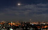 Illustrative: Missiles in the sky near the international airport, in Damascus, Syria, on January 21, 2019. (SANA, Syria's official news agency, via AP/ FIle)