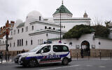 Illustrative: A police car drives past the Grand Mosque in Paris, Friday, March 15, 2019. (AP Photo/Francois Mori)