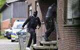 Special police during an investigation into links to the Hezbollah terror group seen in Muenster, western Germany, April 30, 2020. (Martin Meissner/AP)
