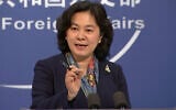 China's Foreign Ministry spokesperson Hua Chunying gestures during a press conference held at the Foreign Ministry in Beijing on December 10, 2020. (AP Photo/Liu Zheng)