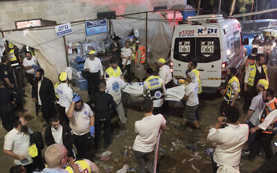 Security officials and rescuers at the scene of a fatal crush during Lag B'Omer celebrations at Mt. Meron in northern Israel, on April 30, 2021. (AP Photo)
