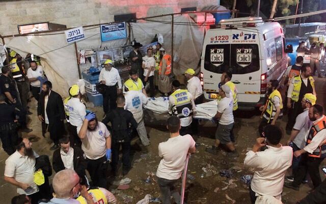 Security officials and rescuers at the scene of a fatal crush during Lag B'Omer celebrations at Mt. Meron in northern Israel, on April 30, 2021. (AP Photo) Security officials and rescuers at the scene of a fatal crush during Lag B'Omer celebrations at Mt. Meron in northern Israel, on April 30, 2021. (AP Photo)