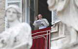 Pope Francis waves after delivering the Regina Caeli noon prayer from the window of his studio overlooking St.Peter's Square, at the Vatican, May 2, 2021. (AP Photo/Alessandra Tarantino)
