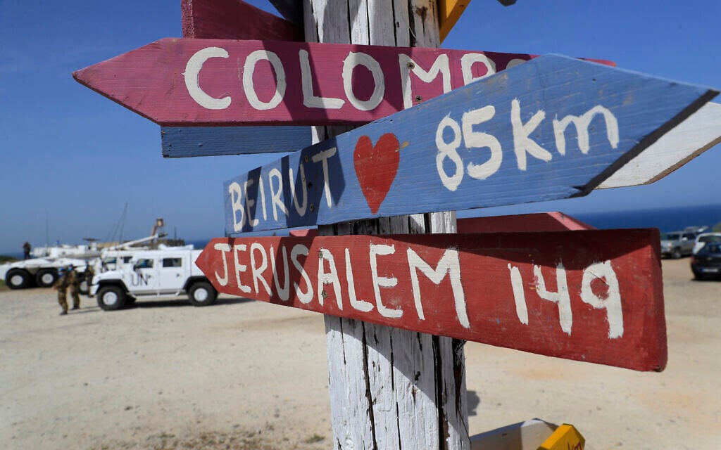 Signs shows the distances of Beirut and Jerusalem, that set at a road that links to a UNIFIL base where the Lebanese and Israeli delegations meet, in Naqoura, Lebanon, Tuesday, May 4, 2021. (AP/Hussein Malla) Signs shows the distances of Beirut and Jerusalem, that set at a road that links to a UNIFIL base where the Lebanese and Israeli delegations meet, in Naqoura, Lebanon, Tuesday, May 4, 2021. (AP/Hussein Malla)