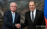 Russian Foreign Minister Sergey Lavrov, right, and Palestinian Foreign Minister Riyad Al-Maliki shake hands as they leave a joint news conference following their talks in Moscow, Russia, May 5, 2021. (AP Photo/Alexander Zemlianichenko, Pool)