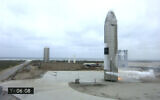 In this image from video made available by SpaceX, a Starship test vehicle sits on the ground after returning from a flight test in Boca Chica, Texas on Wednesday, May 5, 2021. (SpaceX via AP)