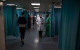 File: Palestinian doctors and medics walk inside the emergency room of the Shifa hospital in Gaza City, May 13, 2021. (AP/Khalil Hamra)