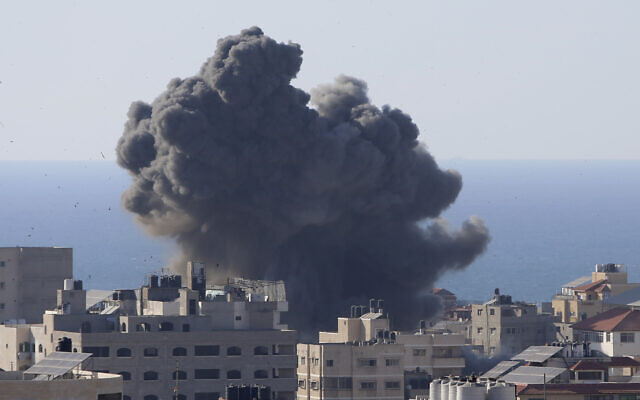 Smoke rises following Israeli airstrikes on a building in Gaza City, Friday, May 14, 2021. (AP/Hatem Moussa) Smoke rises following Israeli airstrikes on a building in Gaza City, Friday, May 14, 2021. (AP/Hatem Moussa)
