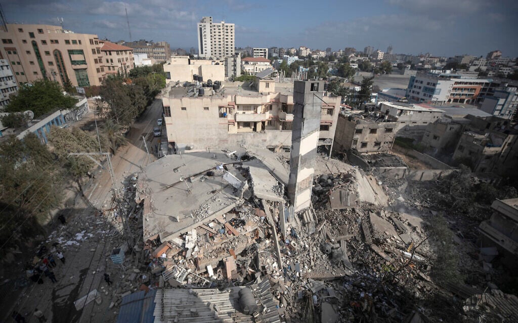 A top view shows the remains of a six-story building which was destroyed by an early morning Israeli airstrike, in Gaza City, May 18, 2021, amid fighting between the Israel Defense Forces and the coastal enclave's Hamas rulers. (AP Photo/Khalil Hamra)