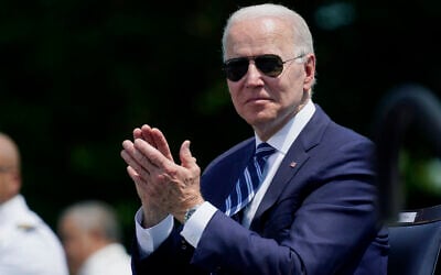 US President Joe Biden applauds during the commencement for the United States Coast Guard Academy in New London, Connecticut, May 19, 2021. (Andrew Harnik/AP)