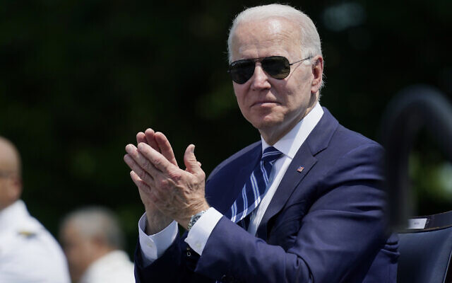US President Joe Biden applauds during the commencement for the United States Coast Guard Academy in New London, Connecticut, May 19, 2021. (Andrew Harnik/AP) US President Joe Biden applauds during the commencement for the United States Coast Guard Academy in New London, Connecticut, May 19, 2021. (Andrew Harnik/AP)