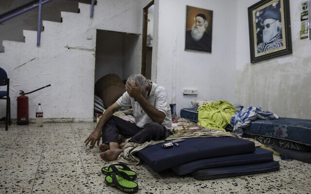 Daniel Turjman, 60, rests in a bomb shelter that is also used as a synagogue near his apartment building in Ashdod, Israel, May 19, 2021 (AP Photo/Heidi Levine) Daniel Turjman, 60, rests in a bomb shelter that is also used as a synagogue near his apartment building in Ashdod, Israel, May 19, 2021 (AP Photo/Heidi Levine)