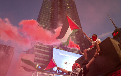 Supporters of the Palestinians march in New York's Times Square Thursday, May 20, 2021. (AP Photo/Craig Ruttle)