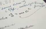 In this undated photograph, provided by Boston-based RR Auction, shows a letter written by Albert Einstein, in which he wrote out his famous "E = mc2" equation, that sold at auction for more than $1.2 million.  (Nikki Brickett/RR Auction via AP)