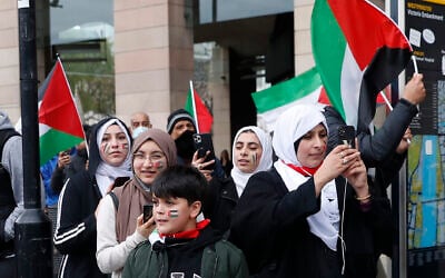 Illustrative -- Protesters hold flags in London, May 22, 2021, as they take part in a pro-Palestinian rally (AP Photo/Alastair Grant)