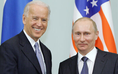 Then-US vice president Joe Biden, left, shakes hands with then-Russian Prime Minister Vladimir Putin in Moscow, Russia, March 10, 2011. (RIA Novosti, Alexei Druzhinin/Pool via AP, file)