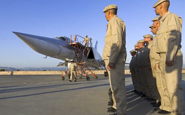 In this photo taken from a video provided on May 25, 2021, by the Russian Defense Ministry Press Service, crew members leave a Russian Tu-22M3 bomber upon its landing at Hemeimeem air base in Syria. (Russian Defense Ministry Press Service via AP) In this photo taken from a video provided on May 25, 2021, by the Russian Defense Ministry Press Service, crew members leave a Russian Tu-22M3 bomber upon its landing at Hemeimeem air base in Syria. (Russian Defense Ministry Press Service via AP)