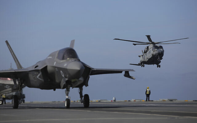 Military personnel direct F-35 jets and helicopters on the deck of the aircraft carrier HMS Queen Elizabeth as it participates in the NATO Steadfast Defender 2021 exercise off the coast of Portugal, May 27, 2021 (AP Photo/Ana Brigida) Military personnel direct F-35 jets and helicopters on the deck of the aircraft carrier HMS Queen Elizabeth as it participates in the NATO Steadfast Defender 2021 exercise off the coast of Portugal, May 27, 2021 (AP Photo/Ana Brigida)