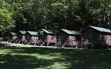 Illustrative: A row of cabins at a summer camp in Fayette, Maine, June 4, 2020. (AP Photo/Robert F. Bukaty, File)