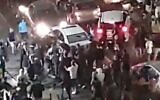 Screen capture from video of a crowd of Jewish protestors pulling an Arab man from his vehicle in Bet Yam, on May 21, 2021. (Twitter)
