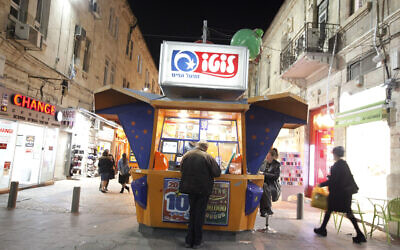 Illustrative: An Israeli man at a "lotto" booth in the center of Jerusalem. (Miriam Alster/Flash90) Illustrative: An Israeli man at a "lotto" booth in the center of Jerusalem. (Miriam Alster/Flash90)