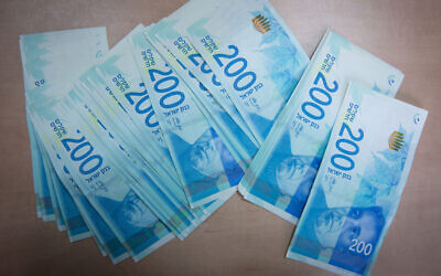 Illustrative photo of the new 200 New Israeli Shekel bill on February 7, 2016. (Nati Shohat/Flash90)