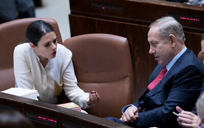 Then-prime minister Benjamin Netanyahu, right, speaks with then justice minister Ayelet Shaked in the Knesset, December 21, 2016. (Yonatan Sindel/Flash90)