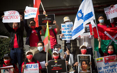 Myanmarese residents in Israel protest against the military coup which took place in Myanmar, outside the Chinese Embassy in Tel Aviv on February 15, 2021. (Miriam Alster/Flash90)