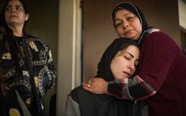 Family members of 33-year-old Munir Anabtawi, who was shot to death after trying to stab a police officer, mourn at their home in Haifa, March 30, 2021. (Roni Ofer/Flash90) Family members of 33-year-old Munir Anabtawi, who was shot to death after trying to stab a police officer, mourn at their home in Haifa, March 30, 2021. (Roni Ofer/Flash90)