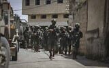 IDF soldiers searching in the village of Aqraba, near the West Bank city of Nablus for a gunman who injured three Israeli teenagers, May 4, 2021. (Flash90)