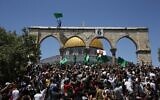 People hold Hamas flags as Palestinians gather at the Dome of the Rock after praying on the last Friday of Ramadan, May 7, 2021. (Jamal Awad/Flash90)