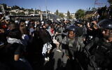 Police clash with protesters demonstrating against the pending eviction of several Palestinian families in the East Jerusalem neighborhood of Sheikh Jarrah on May 7, 2021. (Yonatan Sindel/Flash90)