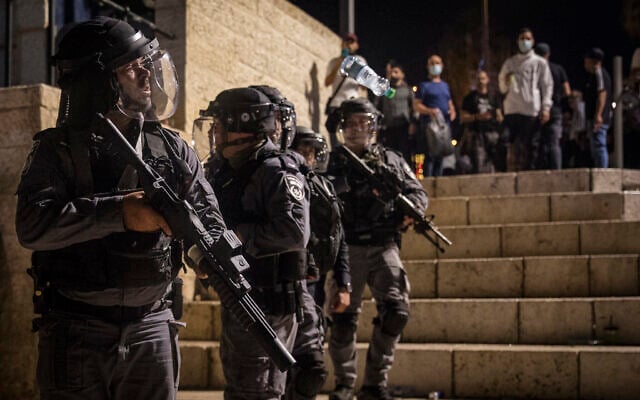Israeli police officers seen during clashes with protesters at Damascus Gate in Jerusalem's Old City, May 8, 2021. (Olivier Fitoussi/Flash90) Israeli police officers seen during clashes with protesters at Damascus Gate in Jerusalem's Old City, May 8, 2021. (Olivier Fitoussi/Flash90)